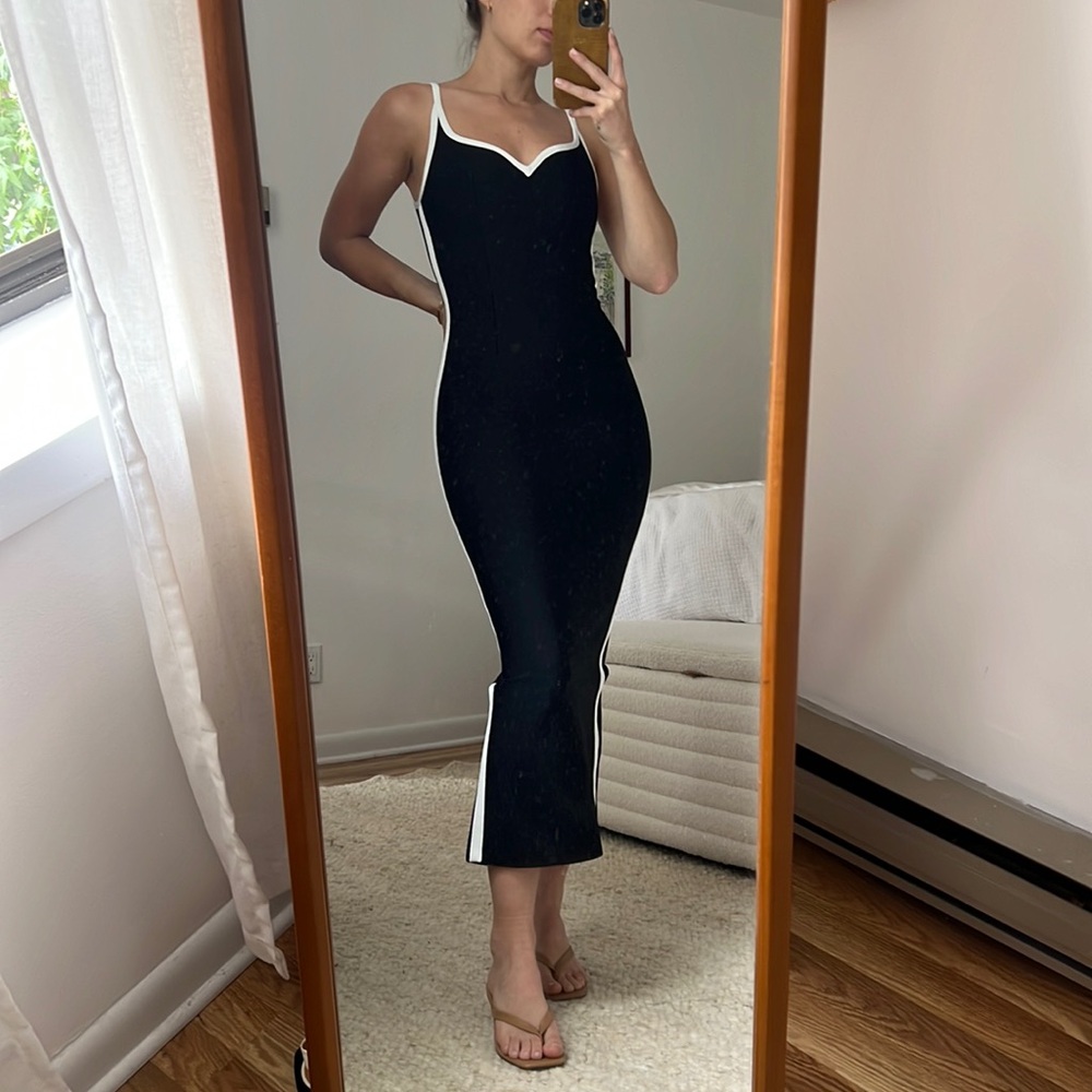 Black Dress, Hervé léger material. White stripe down side & zipper up the back